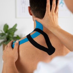 female-physiotherapist-applying-elastic-medical-bandage-male-patient (Custom)